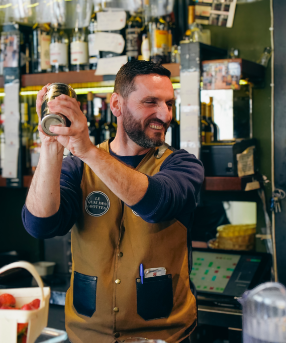 Friendly bartender at Le Quai des Grottes